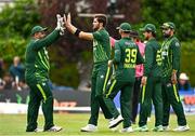14 May 2024; Shaheen Shah Afridi of Pakistan, second from left, celebrates with team-mates after bowling Ross Adair of Ireland during match three of the Floki Men's T20 International Series between Ireland and Pakistan at Castle Avenue Cricket Ground in Dublin. Photo by Sam Barnes/Sportsfile