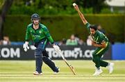 14 May 2024; Hasan Ali of Pakistan bowls watched by Andrew Balbirnie of Ireland during match three of the Floki Men's T20 International Series between Ireland and Pakistan at Castle Avenue Cricket Ground in Dublin. Photo by Sam Barnes/Sportsfile