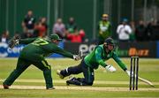14 May 2024; Azam Khan of Pakistan attempts to run out Graham Hume of Ireland during match three of the Floki Men's T20 International Series between Ireland and Pakistan at Castle Avenue Cricket Ground in Dublin. Photo by Sam Barnes/Sportsfile
