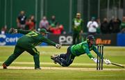 14 May 2024; Azam Khan of Pakistan attempts to run out Graham Hume of Ireland during match three of the Floki Men's T20 International Series between Ireland and Pakistan at Castle Avenue Cricket Ground in Dublin. Photo by Sam Barnes/Sportsfile