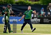 14 May 2024; Curtis Campher of Ireland bowls during match three of the Floki Men's T20 International Series between Ireland and Pakistan at Castle Avenue Cricket Ground in Dublin. Photo by Sam Barnes/Sportsfile