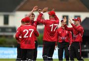 15 May 2024; Josh Manley of Munster Reds is congratulated by his team-mates after taking the wicket of Swapnil Modgil of Leinster Lightning for LBW during the Inter-Provincial IP50 Cup match between Leinster Lightning and Munster Reds at Sydney Parade, Sandymount in Dublin. Photo by Matt Browne/Sportsfile