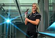 15 May 2024; (EDITORS NOTE: A special effects camera filter was used for this image.) PwC GPA Player of the Month for April in camogie, Karen Kennedy of Tipperary, with her award at PwC’s offices in Dublin. Photo by Sam Barnes/Sportsfile