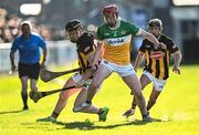 15 May 2024; Ruairí Kelly of Offaly in action against Gearóid Dunne, left, and Rory Glynn of Kilkenny during the oneills.com Leinster GAA Hurling U20 Championship semi-final match between Offaly and Kilkenny at Glenisk O'Connor Park in Tullamore, Offaly. Photo by Piaras Ó Mídheach/Sportsfile