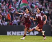 15 May 2024; Nour Youseff, left, of Palestine celebrates after scoring her side's second goal during the international solidarity match between Bohemians and Palestine at Dalymount Park in Dublin. Photo by Stephen McCarthy/Sportsfile