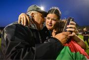 15 May 2024; Palestine goalkeeper Charlotte Phillips with her grandparents George and Odette Dabit after the international solidarity match between Bohemians and Palestine at Dalymount Park in Dublin. Photo by Stephen McCarthy/Sportsfile