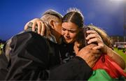 15 May 2024; Palestine goalkeeper Charlotte Phillips with her grandparents George and Odette Dabit after the international solidarity match between Bohemians and Palestine at Dalymount Park in Dublin. Photo by Stephen McCarthy/Sportsfile