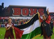 15 May 2024; Palestine players Sara Kord, left, and Hala Sarawi celebrate after their side's victory in the international solidarity match between Bohemians and Palestine at Dalymount Park in Dublin. Photo by Shauna Clinton/Sportsfile