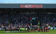 15 May 2024; The Palestine and Bohemians teams stand in front of spectators before the international solidarity match between Bohemians and Palestine at Dalymount Park in Dublin. Photo by Shauna Clinton/Sportsfile