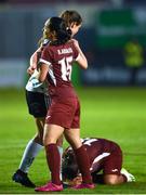 15 May 2024; Bisan Abuaita of Palestine and Lisa Murphy of Bohemians converse as team-mate Nour Youseff, 18, reacts to her side's victory after the international solidarity match between Bohemians and Palestine at Dalymount Park in Dublin. Photo by Shauna Clinton/Sportsfile