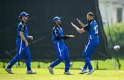 16 May 2024; Leinster Lightning players, from left, Sam Harbinson, Hamish Sidhu and Dylan Leus celebrates taking the wicket of  Ali Frost of Munster Reds during the Inter-Provincial IP20 Trophy match between Leinster Lightning and Munster Reds at Sydney Parade, Sandymount in Dublin. Photo by Harry Murphy/Sportsfile