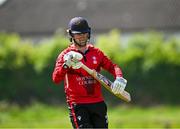 16 May 2024; Oliver Metcalfe of Munster Reds walks after being bowled out during the Inter-Provincial IP20 Trophy match between Leinster Lightning and Munster Reds at Sydney Parade, Sandymount in Dublin. Photo by Harry Murphy/Sportsfile