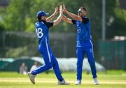 16 May 2024; Dylan Leus of Leinster Lightning, right, celebrates with teammate Sam Harbinson after taking the wicket of Oliver Metcalfe of Munster Reds during the Inter-Provincial IP20 Trophy match between Leinster Lightning and Munster Reds at Sydney Parade, Sandymount in Dublin. Photo by Harry Murphy/Sportsfile