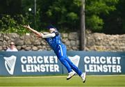 16 May 2024; David Delany of Leinster Lightning catches out Joshua Manley of Munster Reds during the Inter-Provincial IP20 Trophy match between Leinster Lightning and Munster Reds at Sydney Parade, Sandymount in Dublin. Photo by Harry Murphy/Sportsfile