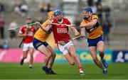 17 May 2024; Diarmuid Healy of Cork in action against Ronan O'Connor and Shane Woods of Clare during the oneills.com Munster GAA U20 Hurling Championship semi-final match between Clare and Cork at Cusack Park in Ennis, Clare. Photo by Brendan Moran/Sportsfile