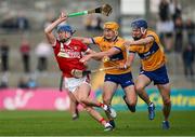 17 May 2024; Diarmuid Healy of Cork in action against Ronan O'Connor and Shane Woods of Clare during the oneills.com Munster GAA U20 Hurling Championship semi-final match between Clare and Cork at Cusack Park in Ennis, Clare. Photo by Brendan Moran/Sportsfile