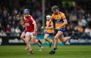 17 May 2024; Niall O'Farrell of Clare in action against Darragh O’Sullivan of Cork during the oneills.com Munster GAA U20 Hurling Championship semi-final match between Clare and Cork at Cusack Park in Ennis, Clare. Photo by Brendan Moran/Sportsfile