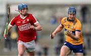 17 May 2024; Shane Woods of Clare in action against Diarmuid Healy of Cork during the oneills.com Munster GAA U20 Hurling Championship semi-final match between Clare and Cork at Cusack Park in Ennis, Clare. Photo by Brendan Moran/Sportsfile