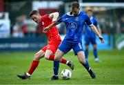 17 May 2024; Rowan McDonald of Waterford in action against John Martin of Shelbourne during the SSE Airtricity Men's Premier Division match between Shelbourne and Waterford at Tolka Park in Dublin. Photo by David Fitzgerald/Sportsfile