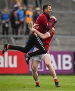 17 May 2024; Barry O’Flynn of Cork celebrates with manager Ben O'Connor after victory at the final whistle of the oneills.com Munster GAA U20 Hurling Championship semi-final match between Clare and Cork at Cusack Park in Ennis, Clare. Photo by Brendan Moran/Sportsfile