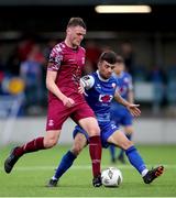 17 May 2024; Dean Larkin of Cobh Ramblers in action against Stephen Christopher of Treaty United  during the SSE Airtricity Men's First Division match between Cobh Ramblers and Treaty United at St. Colman's Park in Cobh, Cork. Photo by Michael P Ryan/Sportsfile