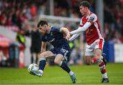 17 May 2024; Adam O'Reilly of Derry City in action against Kian Leavy of St Patrick's Athletic during the SSE Airtricity Men's Premier Division match between St Patrick's Athletic and Derry City at Richmond Park in Dublin. Photo by Stephen McCarthy/Sportsfile