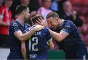 17 May 2024; Paul McMullan, 12, of Derry City celebrates with team-mates Shane McEleney, right, and Patrick Hoban, left, after scoring their side's first goal during the SSE Airtricity Men's Premier Division match between St Patrick's Athletic and Derry City at Richmond Park in Dublin. Photo by Stephen McCarthy/Sportsfile