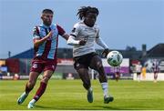 17 May 2024; Al-Amin Kazeem of Galway United in action against Luke Heeney of Drogheda United during the SSE Airtricity Men's Premier Division match between Drogheda United and Galway United at Weavers Park in Drogheda, Louth.  Photo by Shauna Clinton/Sportsfile