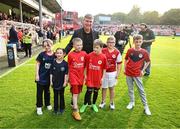 17 May 2024; St Patrick's Athletic manager Stephen Kenny with St Patrick's Athletic mascots before the SSE Airtricity Men's Premier Division match between St Patrick's Athletic and Derry City at Richmond Park in Dublin. Photo by Stephen McCarthy/Sportsfile