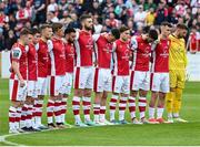 17 May 2024; St Patrick's Athletic players stand for a moments silence before the SSE Airtricity Men's Premier Division match between St Patrick's Athletic and Derry City at Richmond Park in Dublin. Photo by Stephen McCarthy/Sportsfile