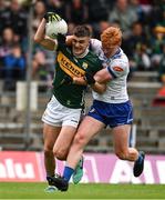 18 May 2024; Sean O'Shea of Kerry is tackled by Ryan O'Toole of Monaghan during the GAA Football All-Ireland Senior Championship Round 1 match between Kerry and Monaghan at Fitzgerald Stadium in Killarney, Kerry. Photo by Brendan Moran/Sportsfile