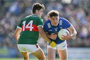 18 May 2024; Oisin Kiernan of Cavan in action against Tommy Conroy of Mayo during the GAA Football All-Ireland Senior Championship Round 1 match between Mayo and Cavan at Hastings Insurance MacHale Park in Castlebar, Mayo. Photo by Stephen Marken/Sportsfile