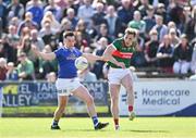 18 May 2024; Gerard Smith of Cavan in action against Eoghan McLaughlin of Mayo during the GAA Football All-Ireland Senior Championship Round 1 match between Mayo and Cavan at Hastings Insurance MacHale Park in Castlebar, Mayo. Photo by Stephen Marken/Sportsfile