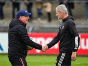 18 May 2024; The Cork manager John Cleary, left, and Clare manager Mark Fitzgerald shake hands before during the GAA Football All-Ireland Senior Championship Round 1 match between Clare and Cork at Cusack Park in Ennis, Clare. Photo by Ray McManus/Sportsfile