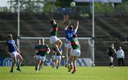 18 May 2024; Jordan Flynn of Mayo and Oisin Kiernan of Cavan compete for a high ball during the GAA Football All-Ireland Senior Championship Round 1 match between Mayo and Cavan at Hastings Insurance MacHale Park in Castlebar, Mayo. Photo by Stephen Marken/Sportsfile