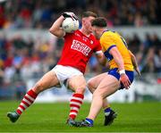 18 May 2024; Conor Corbett of Cork in action against Cillian Rouine of Clare during the GAA Football All-Ireland Senior Championship Round 1 match between Clare and Cork at Cusack Park in Ennis, Clare. Photo by Ray McManus/Sportsfile
