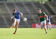 18 May 2024; Cian Madden of Cavan in action against Matthew Ruane of Mayo during the GAA Football All-Ireland Senior Championship Round 1 match between Mayo and Cavan at Hastings Insurance MacHale Park in Castlebar, Mayo. Photo by Stephen Marken/Sportsfile