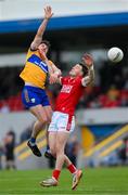 18 May 2024; Aaron Griffin of Clare and Daniel O'Mahony of Cork fail to catch the ball during the GAA Football All-Ireland Senior Championship Round 1 match between Clare and Cork at Cusack Park in Ennis, Clare. Photo by Ray McManus/Sportsfile