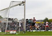 18 May 2024; Cein Darcy of Galway scores his side's second goal past Derry goalkeeper Odhran Lynch during the GAA Football All-Ireland Senior Championship Round 1 match between Galway and Derry at Pearse Stadium in Galway. Photo by Stephen McCarthy/Sportsfile
