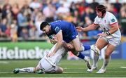 18 May 2024; Harry Byrne of Leinster is tackled by John Cooney and Eric O'Sullivan of Ulster during the United Rugby Championship match between Ulster and Leinster at Kingspan Stadium in Belfast. Photo by Ramsey Cardy/Sportsfile