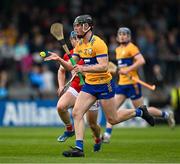 17 May 2024; Niall O'Farrell of Clare in action against Darragh O’Sullivan of Cork during the oneills.com Munster GAA U20 Hurling Championship semi-final match between Clare and Cork at Cusack Park in Ennis, Clare. Photo by Brendan Moran/Sportsfile