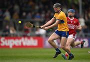 17 May 2024; Niall O'Farrell of Clare in action against Darragh O’Sullivan of Cork during the oneills.com Munster GAA U20 Hurling Championship semi-final match between Clare and Cork at Cusack Park in Ennis, Clare. Photo by Brendan Moran/Sportsfile