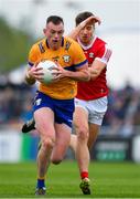 18 May 2024; Darragh Bohannon of Clare in action against Paul Walsh of Cork during the GAA Football All-Ireland Senior Championship Round 1 match between Clare and Cork at Cusack Park in Ennis, Clare. Photo by Ray McManus/Sportsfile