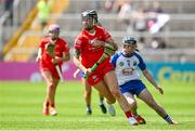 19 May 2024; Ashling Thompson of Cork in action against Orla Hickey of Waterford during the Munster Senior Camogie Championship final match between Cork and Waterford at FBD Semple Stadium in Thurles, Tipperary. Photo by Brendan Moran/Sportsfile