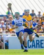 19 May 2024; Jack Prendergast of Waterford in action against Cian Galvin of Clare during the Munster GAA Hurling Senior Championship Round 4 match between Clare and Waterford at Cusack Park in Ennis, Clare. Photo by John Sheridan/Sportsfile