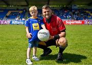 19 May 2024; Referee Conor Dourneen with Wicklow mascot Jacob Moran, age 6, from Avoca before the Tailteann Cup Round 2 match between Wicklow and Laois at Echelon Park in Aughrim, Wicklow. Photo by Stephen Marken/Sportsfile