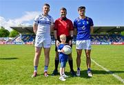19 May 2024; Referee Conor Dourneen with Laois captain Evan O'Carroll, Wicklow captain Patrick O'Keane and mascot Jacob Moran, age 6, from Avoca before the Tailteann Cup Round 2 match between Wicklow and Laois at Echelon Park in Aughrim, Wicklow. Photo by Stephen Marken/Sportsfile