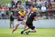19 May 2024; Conor McDonald of Wexford in action against Carlow goalkeeper Brian Tracey during the Leinster GAA Hurling Senior Championship Round 4 match between Carlow and Wexford at Netwatch Cullen Park in Carlow. Photo by Michael P Ryan/Sportsfile