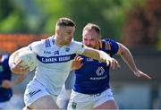 19 May 2024; Evan O'Carroll of Laois in action against Eoin Murtagh of Wicklow during the Tailteann Cup Round 2 match between Wicklow and Laois at Echelon Park in Aughrim, Wicklow. Photo by Stephen Marken/Sportsfile