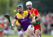 19 May 2024; Liam Óg McGovern of Wexford in action against Kevin McDonald of Carlow during the Leinster GAA Hurling Senior Championship Round 4 match between Carlow and Wexford at Netwatch Cullen Park in Carlow. Photo by Michael P Ryan/Sportsfile